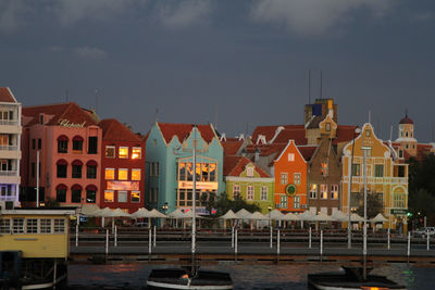 Residential district against sky at night