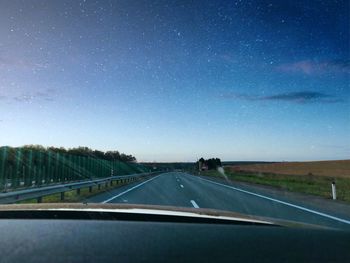 Road seen through car windshield