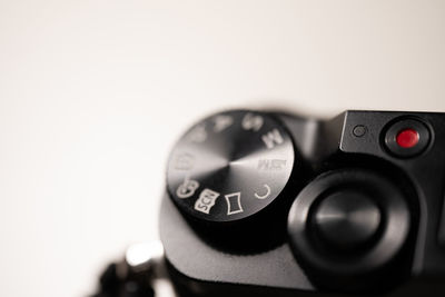 Close-up of camera lens against white background