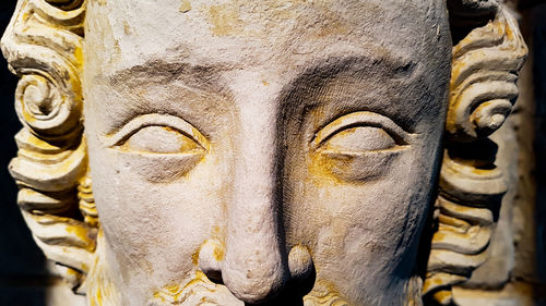 Close-up of buddha statue in temple