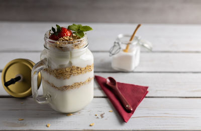 Close-up of drink in glass jar on table