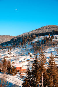 High angle view of townscape against clear blue sky
