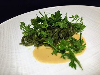 High angle view of vegetables in plate on table