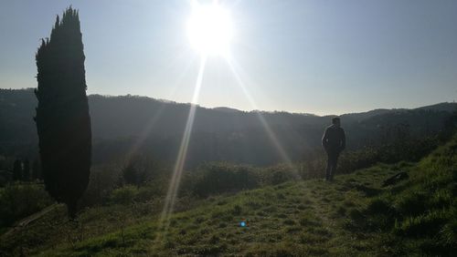 Man on field against clear sky