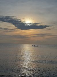 Scenic view of sea against sky during sunrise