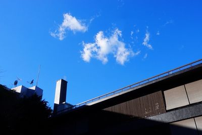 Low angle view of silhouette building against sky