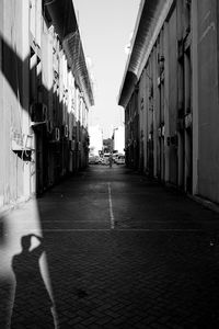 Alley amidst buildings in city