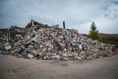 Stack of garbage against built structure