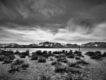 Scenic view of mountains against cloudy sky