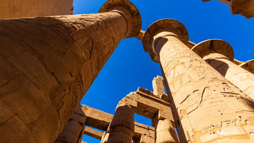 Low angle view of old ruins against clear sky