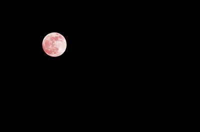 Low angle view of moon against sky at night