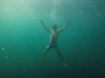 Man swimming in sea