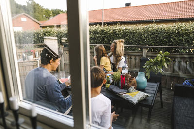 Parents spending leisure time with children in balcony