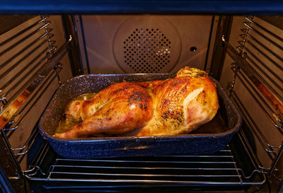 Roast turkey in oven. thanksgiving dinner