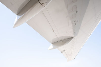 Low angle view of airplane flying in sky