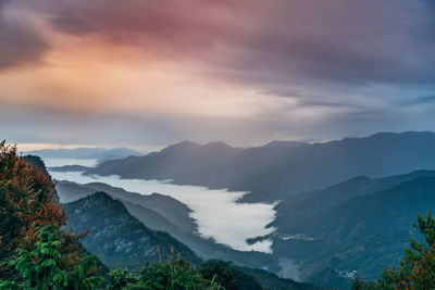 Scenic view of mountains against sky during sunset