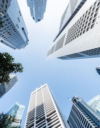 Low angle view of modern buildings against clear sky