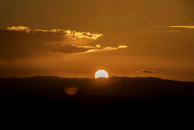 Scenic view of silhouette landscape against sky during sunset