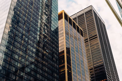 Low angle view of modern buildings against sky