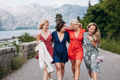 Friends standing on mountain road