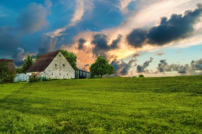 House on field against sky