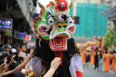 Close-up of person wearing costume in city during event