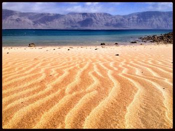 Scenic view of beach against sky