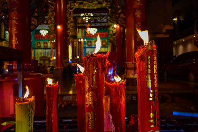 Interior of illuminated temple outside building