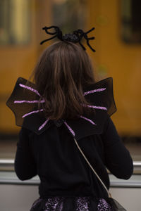 Rear view of girl wearing costume