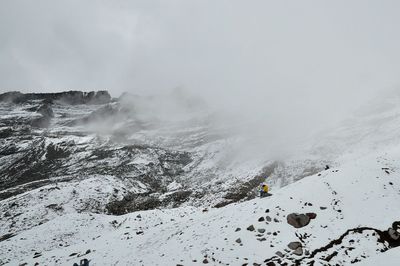 Scenic view of tree mountains against sky during winter