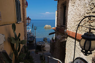 Scenic view of sea against buildings