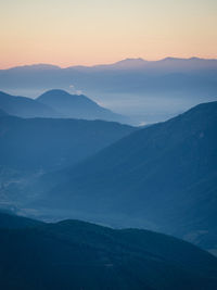 Scenic view of mountains against sky during sunset