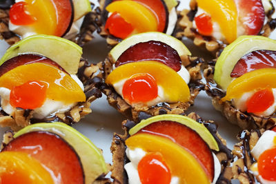 Close-up of fresh tomatoes with fruits