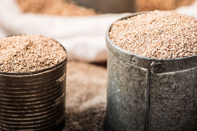 Close-up of sesame seeds in containers