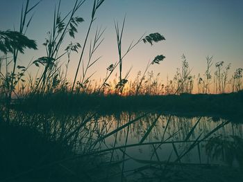 Scenic view of lake against sky during sunset