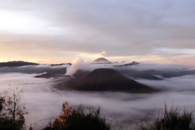 View of volcanic landscape against cloudy sky