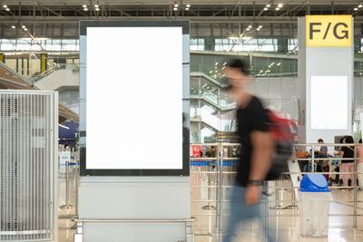 Blank advertising billboard at airport,mockup poster media template ads display	
