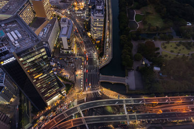 High angle view of illuminated buildings in city at night