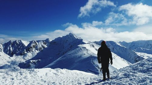 People standing on snow covered landscape