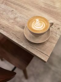 High angle view of coffee on wooden table