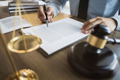 Midsection of man holding table