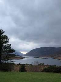 Scenic view of lake and mountains against sky