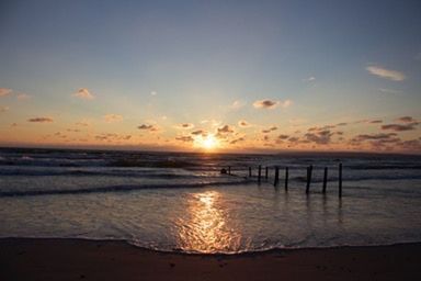 Scenic view of sea at sunset