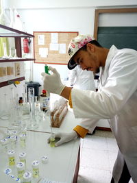 Side view of man working in laboratory