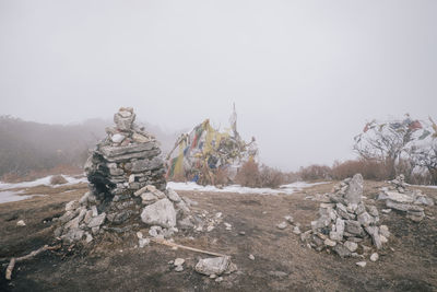 Stack of rocks against clear sky