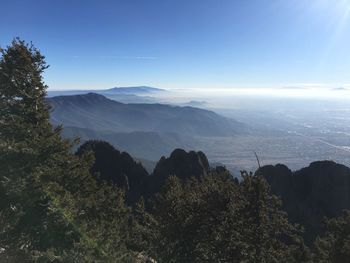 Scenic view of mountains against cloudy sky