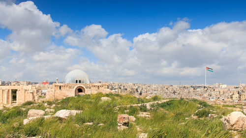 Ummayad palace and old ruins against cloudy sky