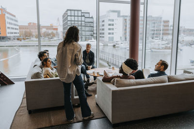 Businesswoman discussing strategy with colleagues in conference meeting