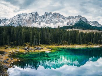 Scenic view of lake and mountains against sky