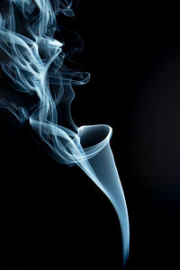 Close-up of smoke against black background